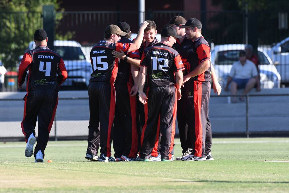 UP AND ABOUT: White Hills celebrate an early wicket against Bendigo United in the Twenty20 final on Wednesday night. Picture: NONI HYETT
