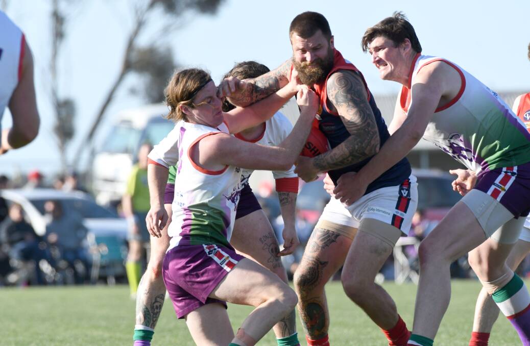 HOT CONTEST: Only 12 points separated Wycheproof-Narraport and Birchip-Watchem in Saturday's North Central league grand final at Boort. The Demons kicked the last four goals of the game to prevail. Picture: NONI HYETT