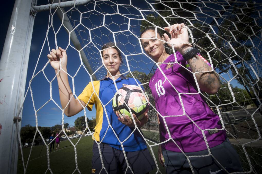 PROMOTION: Bendigo South East College student Mietta Carusoe with former Australian Matildas captain Melissa Barbieri, who was in Bendigo this week ahead of the BASL's new all-girls winter competition. Picture: DARREN HOWE