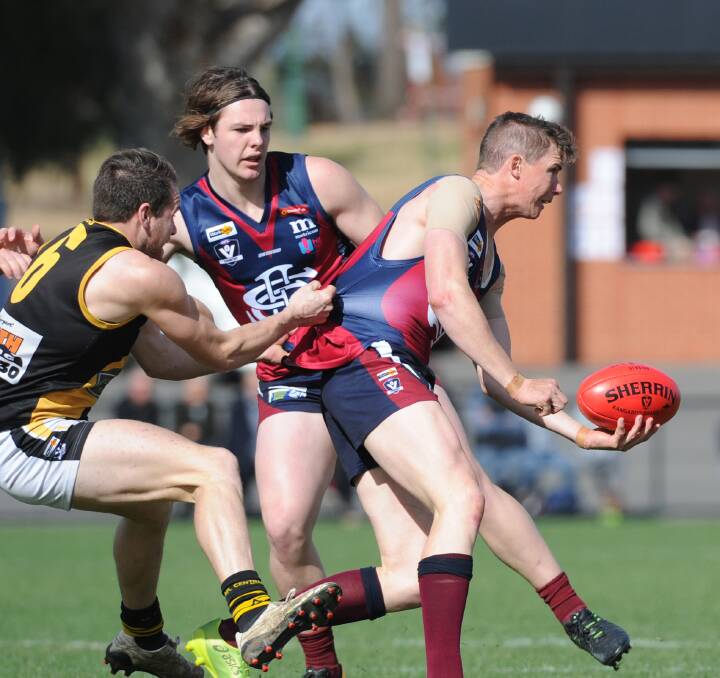 BIG GAME: Sandhurst's Andrew Collins proved a headache for Kyneton in Sunday's elimination final at the QEO. The Dragons won by five points. Picture: NONI HYETT