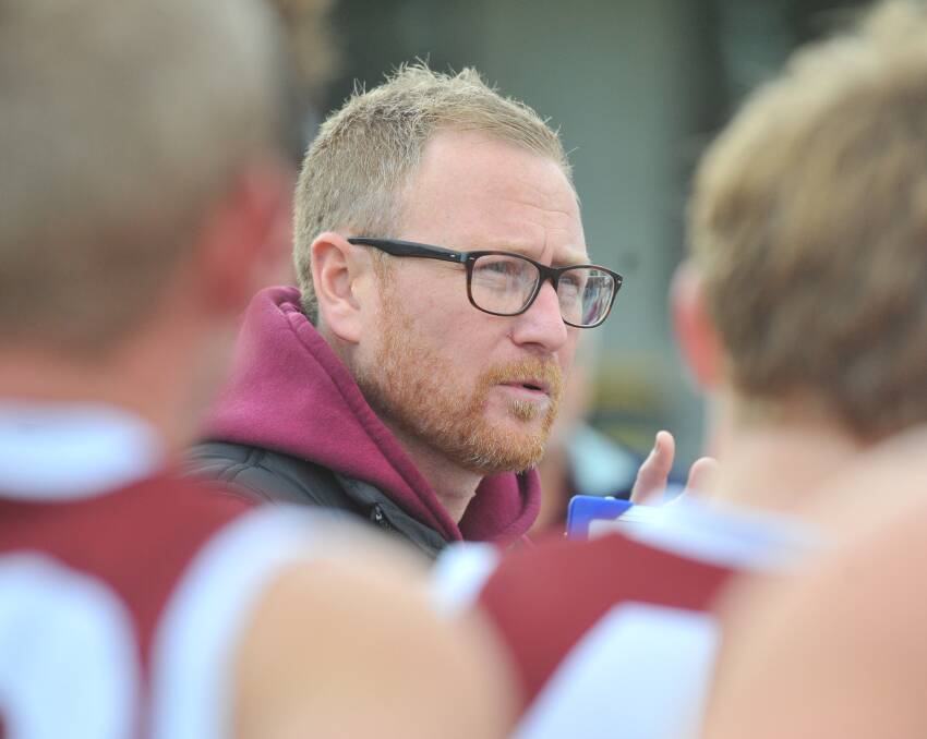 INSTRUCTIONS: Newbridge coach Matt Dillon addresses his players at quarter-time on Saturday, at which stage the Maroons were one point down against Bridgewater.