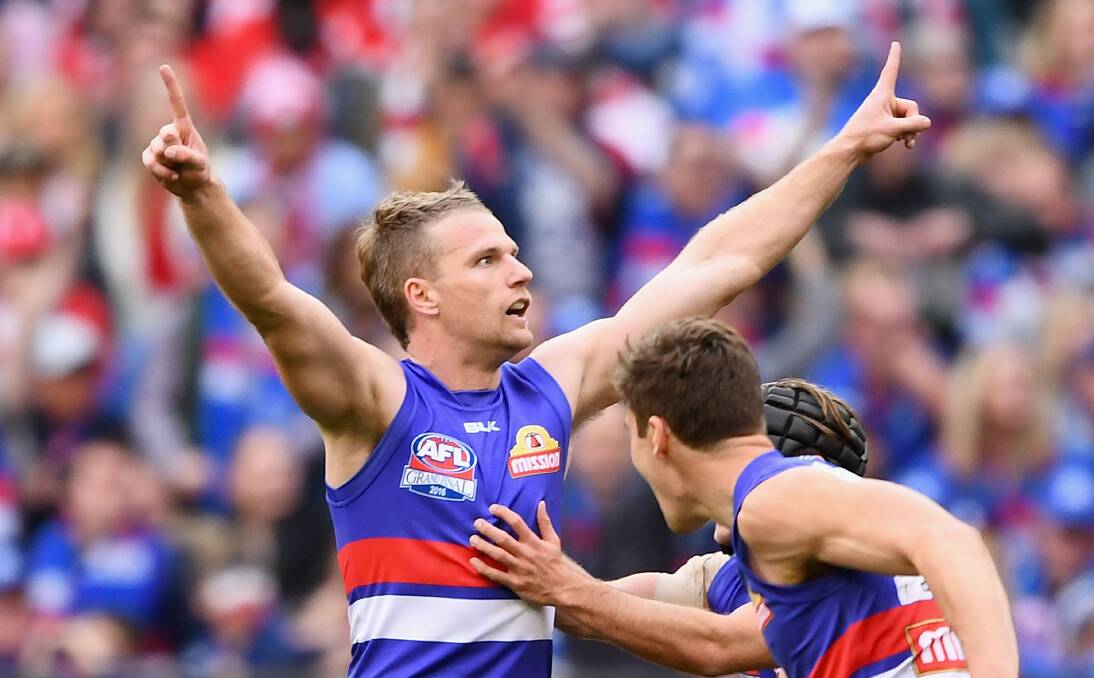 PIVOTAL MOMENT: Jake Stringer after kicking the goal that put the Bulldogs seven points clear during the last quarter. Picture: GETTY IMAGES