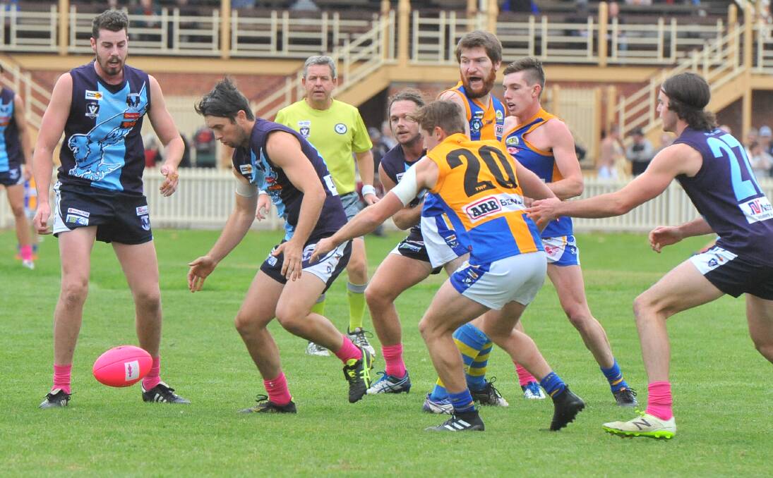 CONTEST: Eaglehawk midfielder Brodie Collins prepares to pounce on the ball against Golden Square on Saturday. Picture: ADAM BOURKE