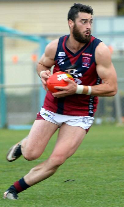 BULLOCKING DRAGON: Sandhurst midfielder Adam Parry. The Dragons beat Eaglehawk by 50 points at Canterbury Park on Saturday to keep third spot. 