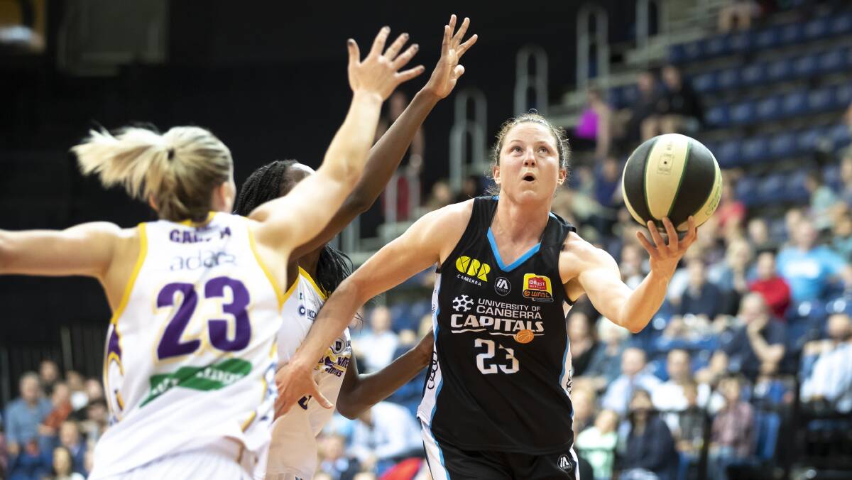 ON THE ATTACK: Kelsey Griffin drives to the basket for Canberra against Melbourne earlier this season. Picture: SITTHIXAY DITTHAVONG
