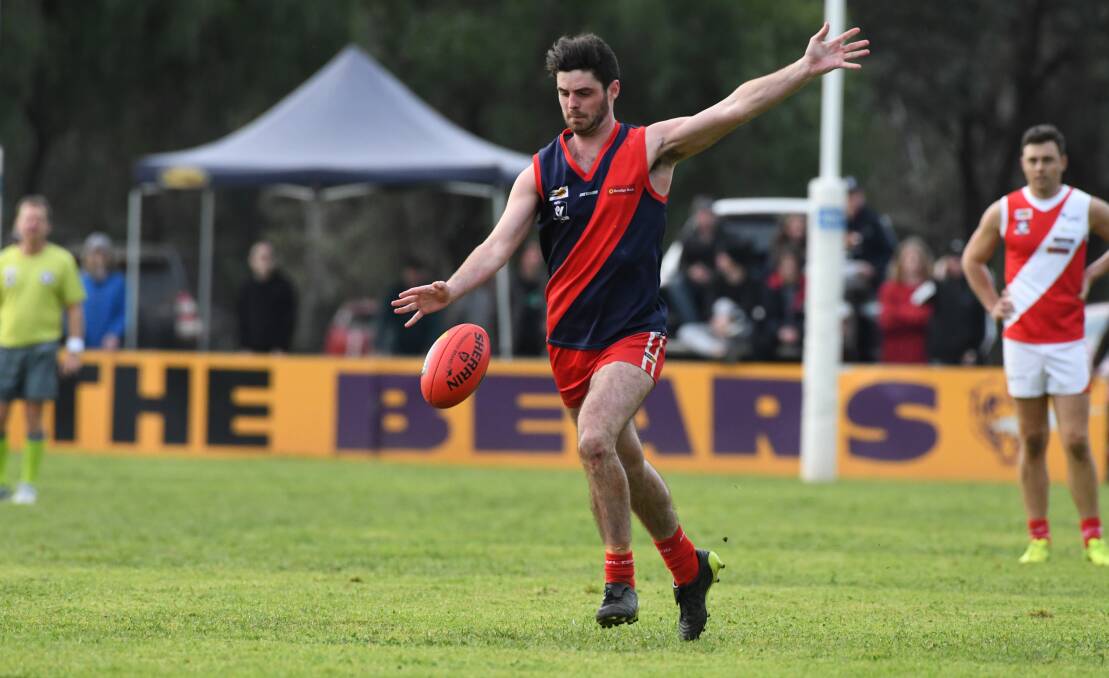 SINK THE BOOT IN: Luke Marchesi slotted four goals for Calivil United in the Demons' win. Picture: NONI HYETT