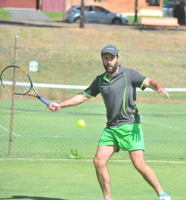 DETERMINED: Spring Gully Strath Eppalock Butterflies' Jake Grieves in action during his singles match against Strathfieldsaye's Lachlan Perdon in round three of BTA premier league on Saturday. Picture: LUKE WEST