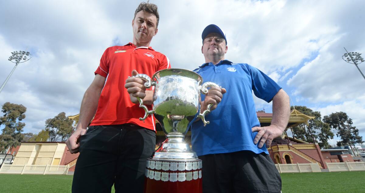 BATTLE LINES DRAWN: Bridgewater captain Darren Clutton and Mitiamo coach Denis Grinton with the LVFL premiership cup up for grabs on Saturday. Picture: DARREN HOWE