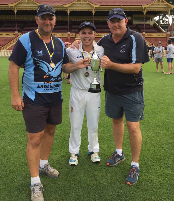 ALL SMILES: Eaglehawk coach David Rosaia, captain Cory Jacobs and president Ash Piercy with the BDCA premiership cup after the weekend's three-wicket grand final win over Bendigo United at the QEO. Picture: LUKE WEST