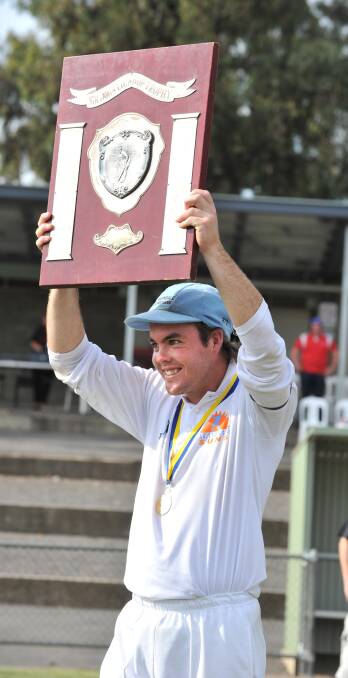 DYNASTY BEGINS: Linton Jacobs holds aloft the premiership shield in 2011 in what would be the first of five first XI flags he captained Strathdale-Maristians to.