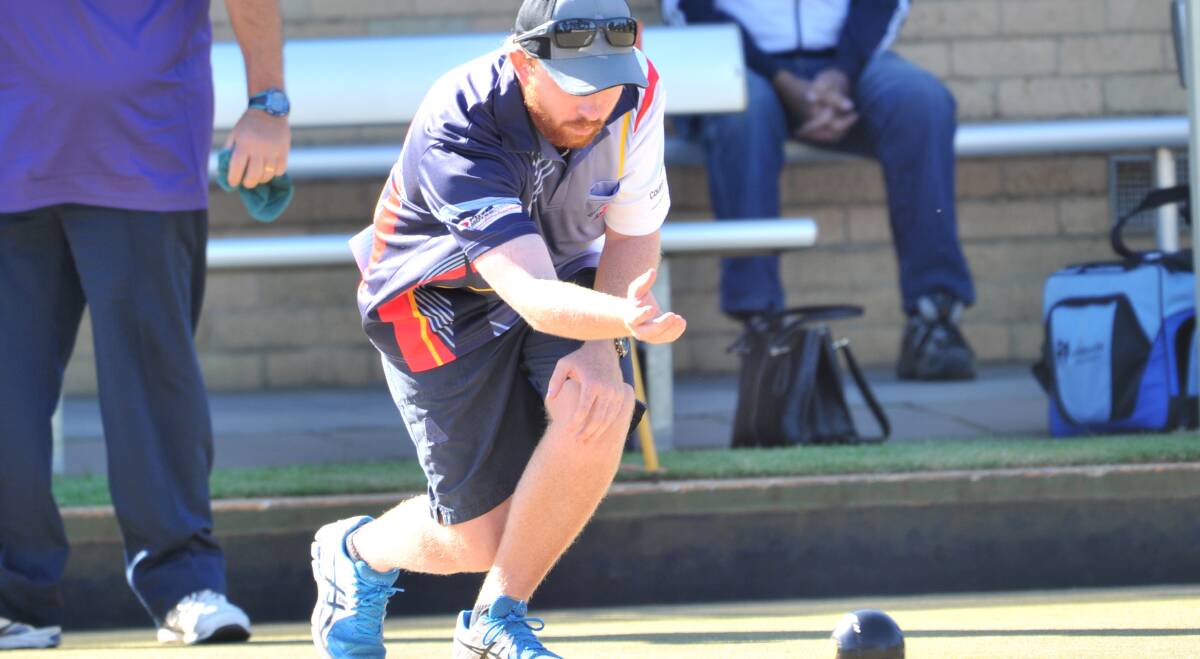 CONCENTRATION: Bendigo's Andrew Brown sends down a bowl in Friday's mixed pairs final at Bendigo East. Picture: NONI HYETT