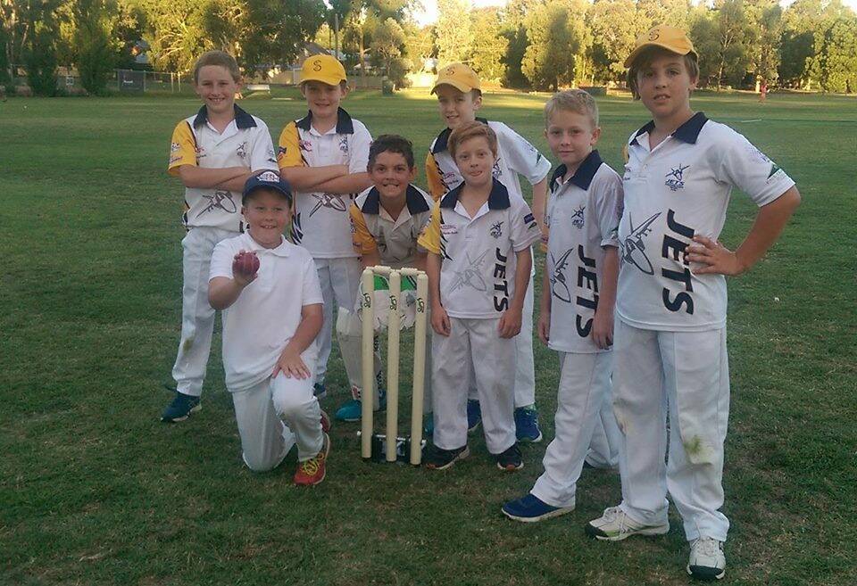 WHAT A START: Lochie Dennis (holding the ball) with his Strathfieldsaye Blue team-mates last Friday night after he took five wickets in his first over. Picture: CONTRIBUTED