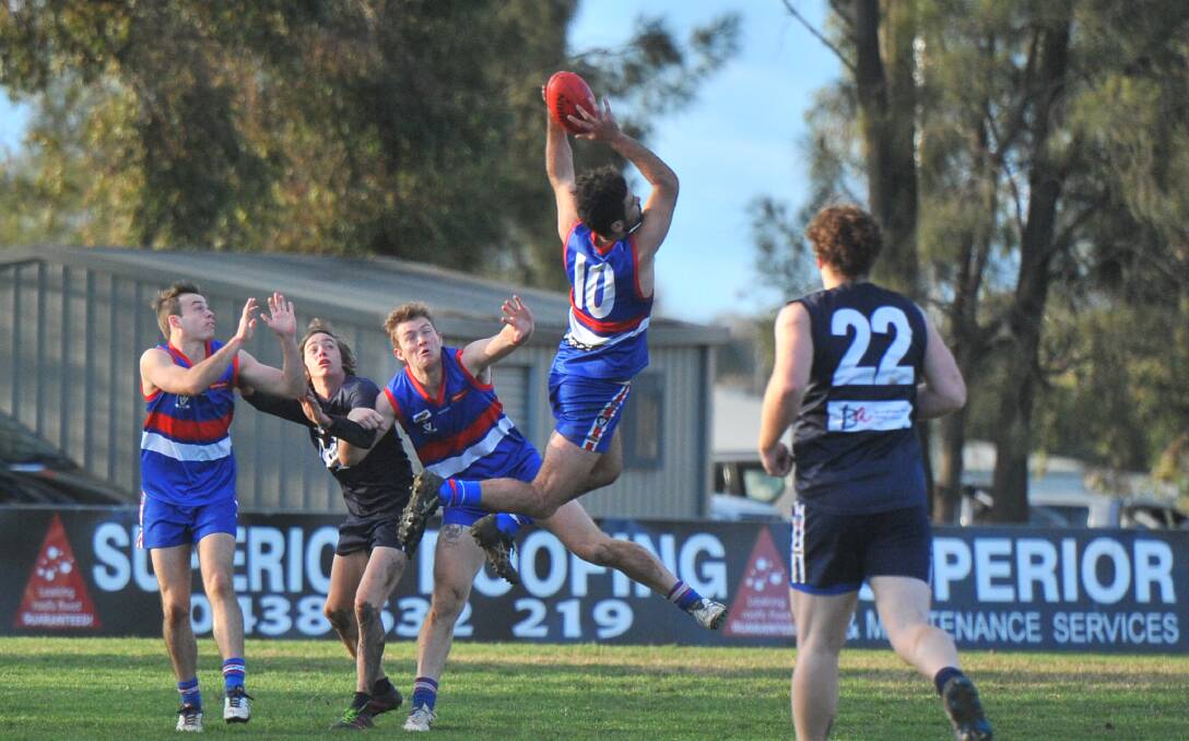 LEAP: North Bendigo defender Alex Shiphard soars across the pack to take a mark against Mount Pleasant on Saturday. Pictures: LUKE WEST