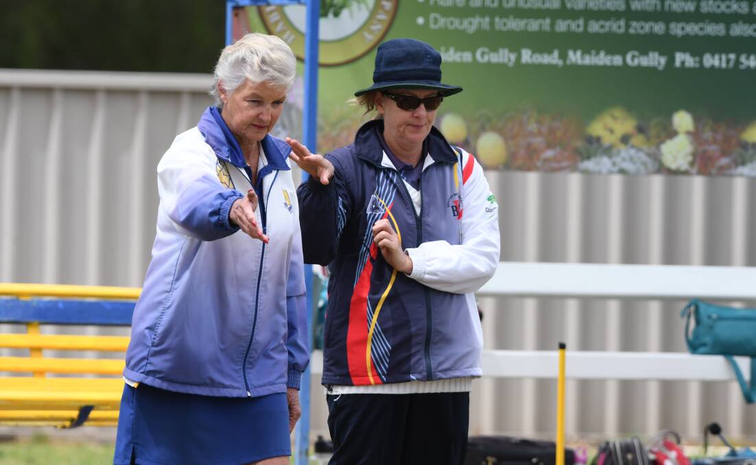 BIG GAME LOOMS: Golden Square's Ruth Pearce and Bendigo's Lee Harris. The two sides played a 61-all tie in round three. Picture: NONI HYETT