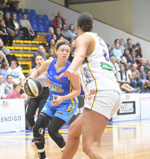 FINE GAME: Rachel Banham, who is defended by Melbourne Boomers' star Liz Cambage, led the Spirit scoring with 17 points on Saturday night. The Spirit won their second game of the WNBL season. Picture: LUKE WEST