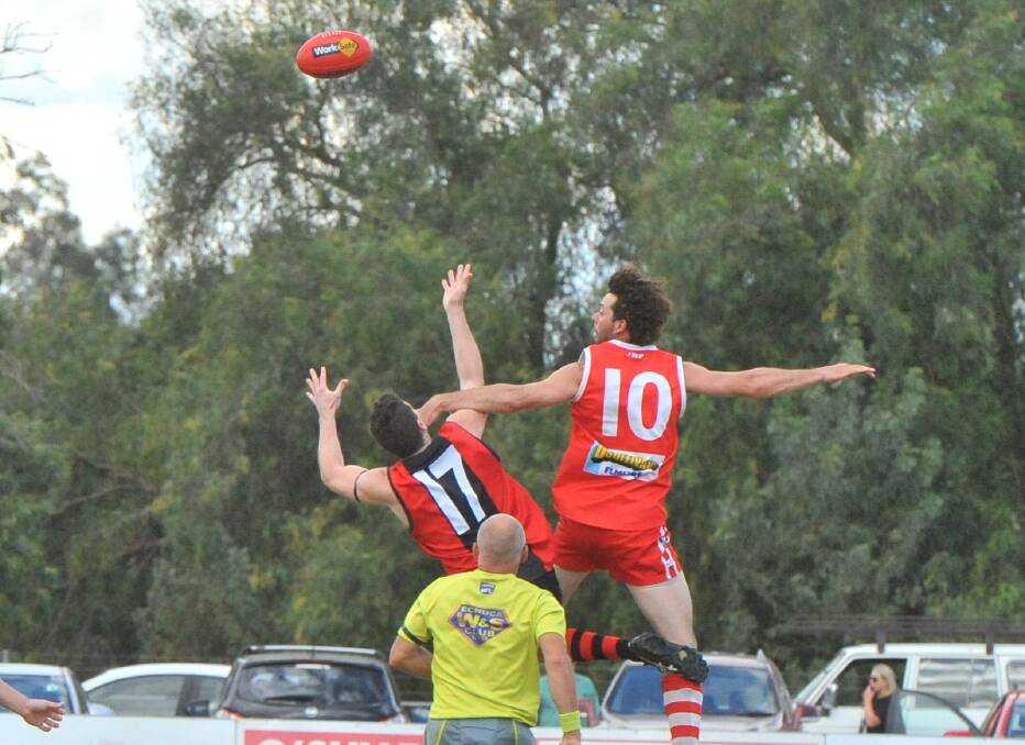 NEW YEAR UNDERWAY: White Hills' Lachlan Sidebottom and Elmore's Jack Hayes contest the opening bounce of the 2017 Heathcote District season on Saturday.
