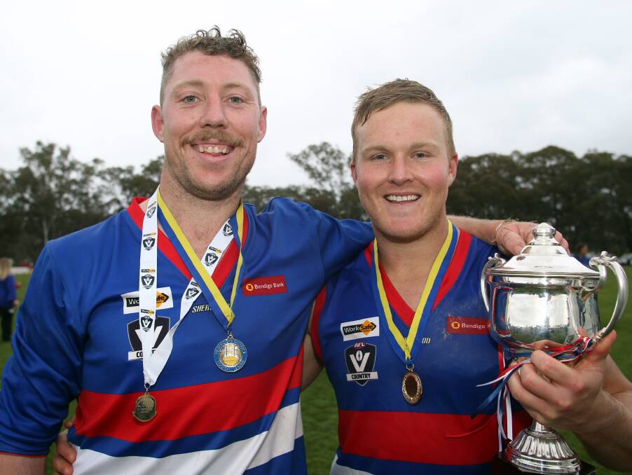 ALL SMILES: North Bendigo's Sam Barnes, who kicked seven goals and was voted best on ground, and Darcy Richards during the post-match celebrations.