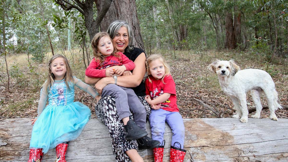 Maryanne Land, her triplets and her dog Tilly.