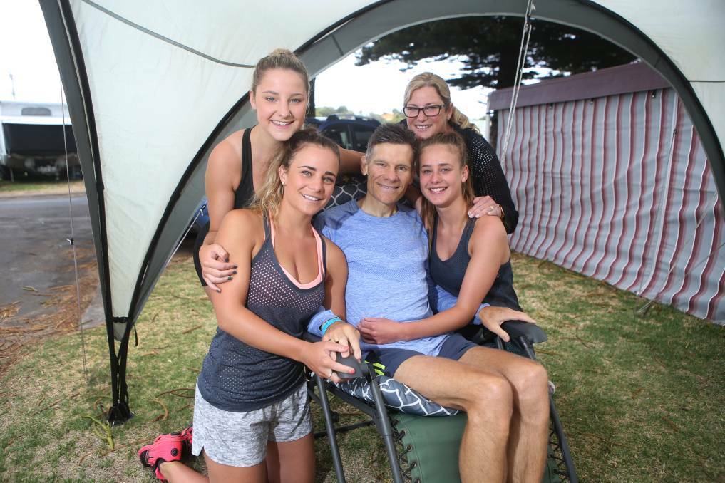 FAMILY MAN: Mr Wilson with daughters Mikaela, 21, Jessey, 19, and Ellie,15, and wife Sharon at this year's Surf ‘T’ Surf in Warrnambool. Picture: AMY PATON