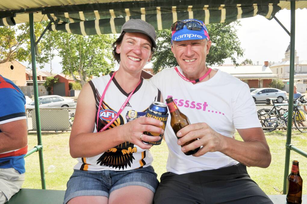 CHEERS DUNOLLY: Peta Hill and Geoff Gatt of the Sneaky Butchers riding club enjoy a $3 stubby at the Dunolly Bowls Club after another 'tough day in the office'. Pictures: NONI HYETT
