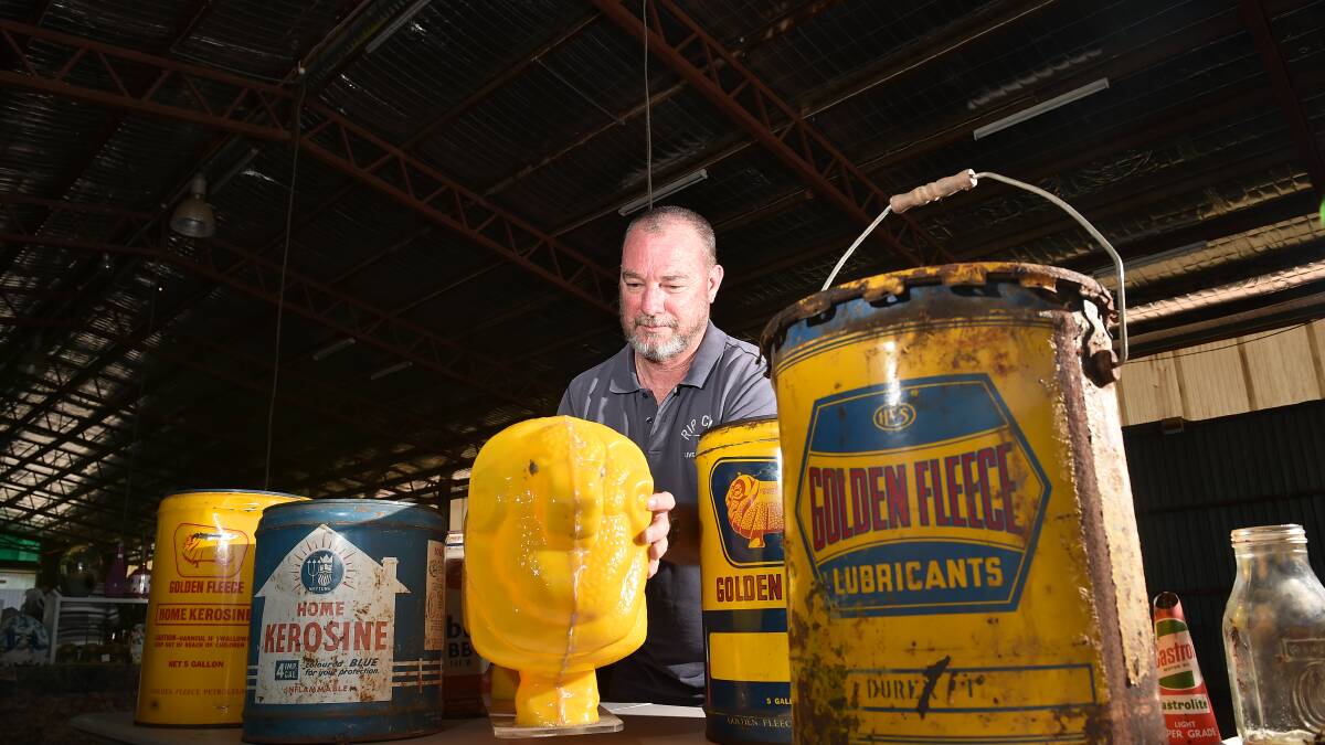 RUST BUCKETS: Justin Heard with some of the collectables likely to put old rev heads into overdrive. Pictures: NONI HYETT