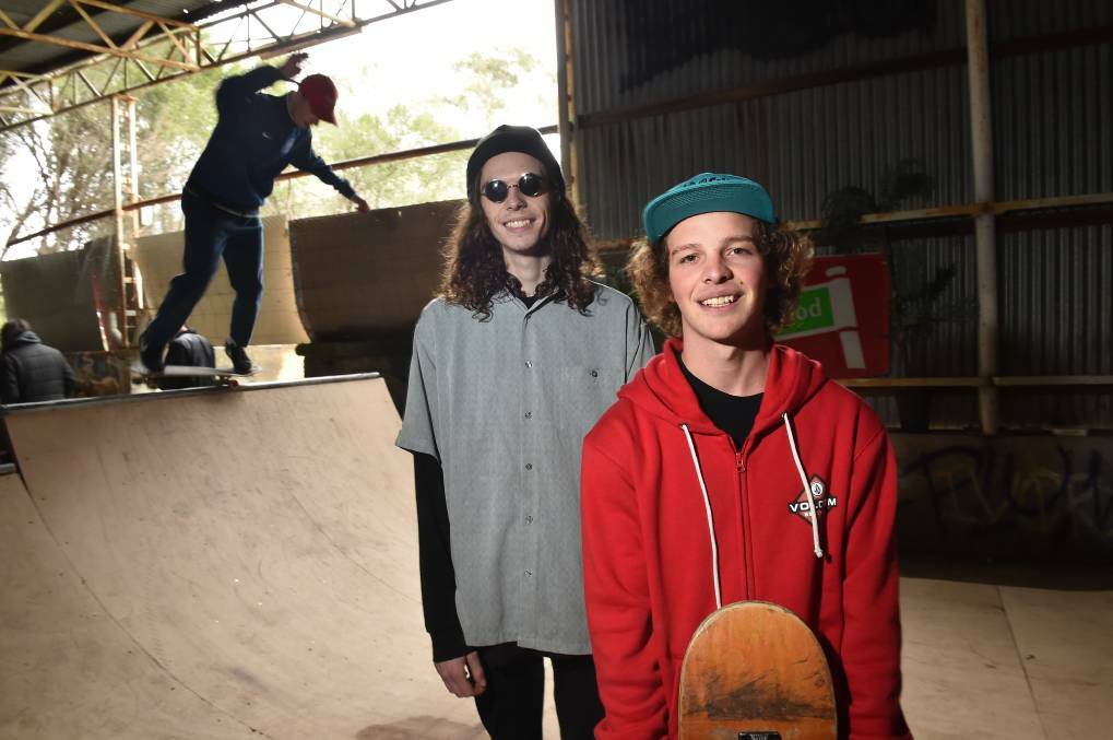 SAVE OUR SPACE: Tyler Wilkinson and Toby Gujer in the abandoned former Bendigo State Government Battery which they have converted into an indoor skate park. Picture: NONI HYETT
