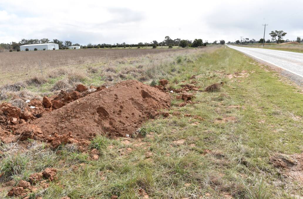 A WHOLE: Lot of mystery surrounds a crater which appeared by the side of the road two weeks ago, seen here after it was filled with soil. Picture: JODIE WIEGARD