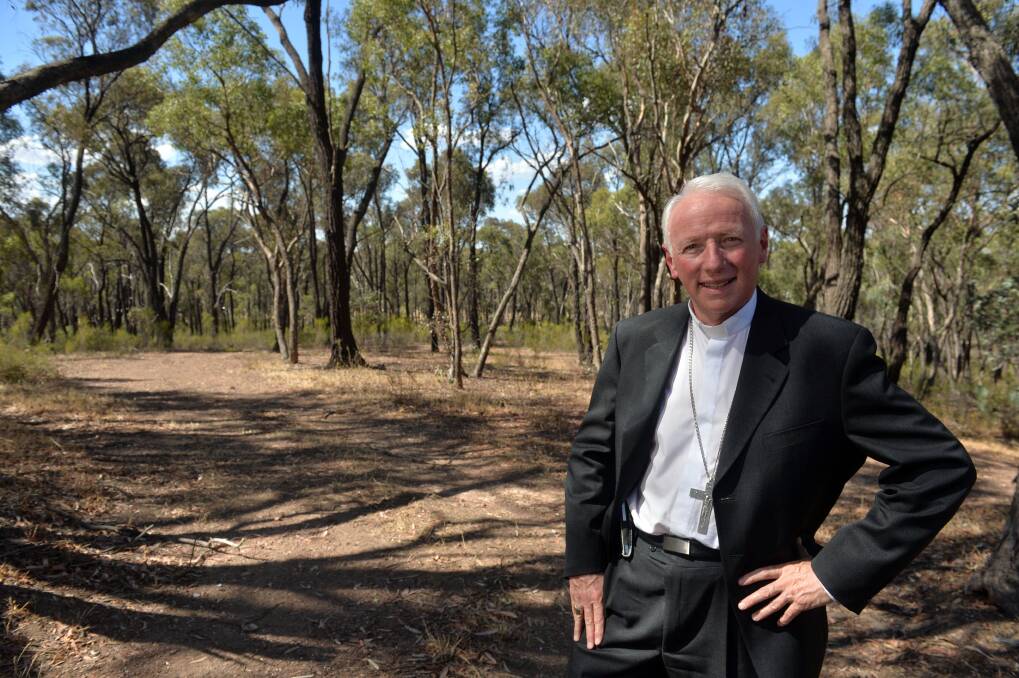 GIFTED: Diocese of Sandhurst Bishop Les Tomlinson in some of the Aspinall Street bushland which will be gifted by the church as a nature reserve. 