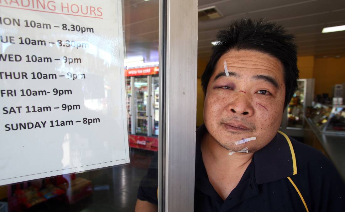 UNDAUNTED:  Jianxin 'John' Huang was back to work Sunday despite being hospitalised Saturday after trying to stop thieves stealing charity money. Pictures: GLENN DANIELS