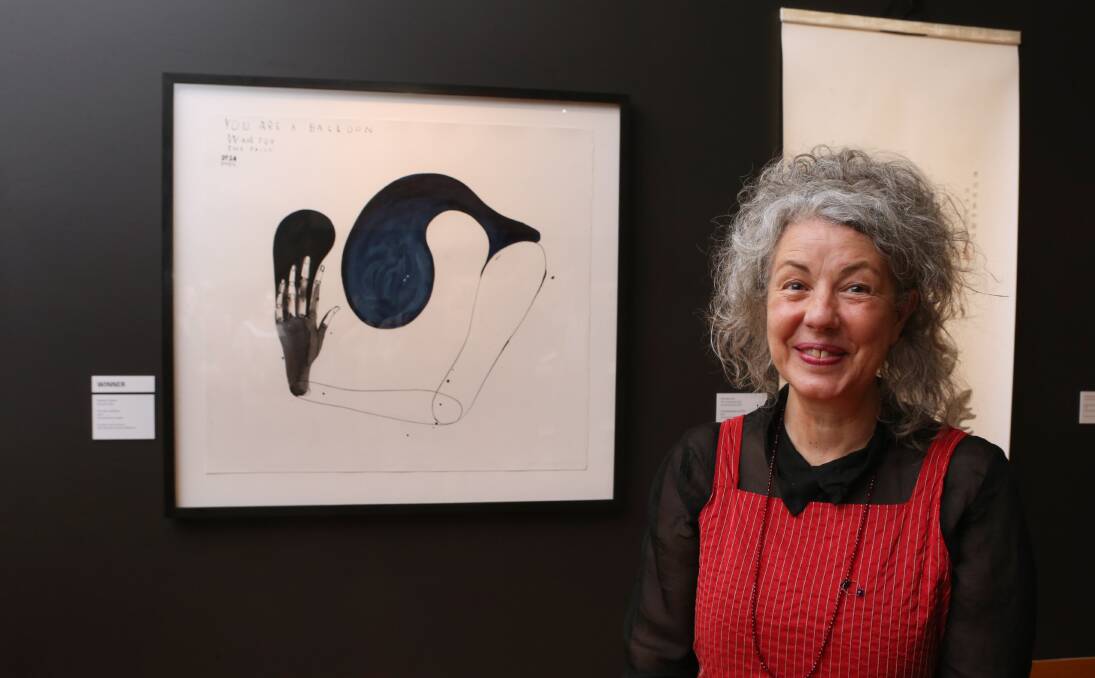 2014 WINNER: Melbourne-based sculptor Heather Swann with her ink and wash on paper piece titled 'You are a Balloon'.