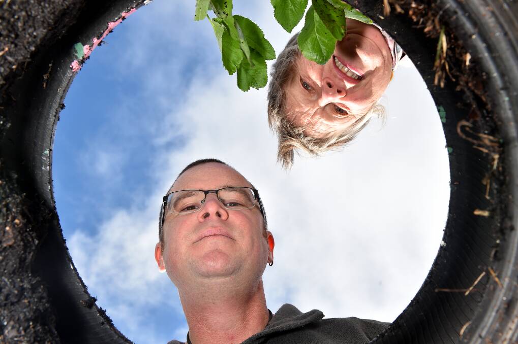 TREE THEFT: St Matthew's Church's David Fagg and Liesje Wilson are ready to forgive after a string of midnight raids on their gardens. Picture: NONI HYETT
