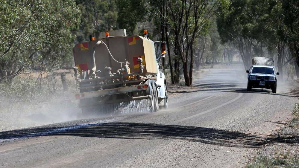 ISSUE: A truck sprays water along McKinnons Road, one of two roads flagged as problematic by residents. Picture: GLENN DANIELS
