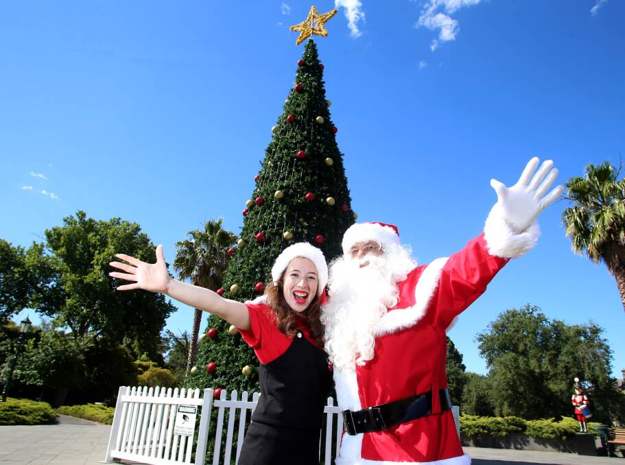Santa celebrates the Christmas tree going up in Rosalind Park but business is fuming Christmas Day will be a public holiday. Picture: GLENN DANIELS