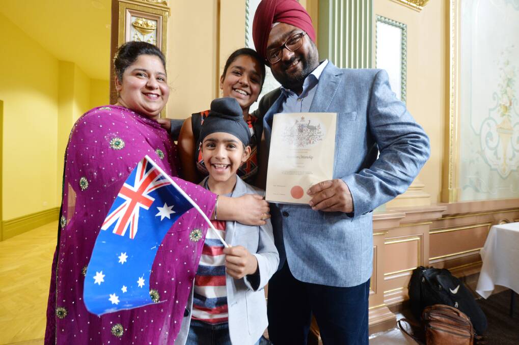 Jagjit and Ekbal Singh with their children Guneet and Maher, who were both born in Australia – yesterday Mr Singh joined the rest of his family by officially becoming an Australian citizen after 20 years living in this country. Pictures: DARREN HOWE