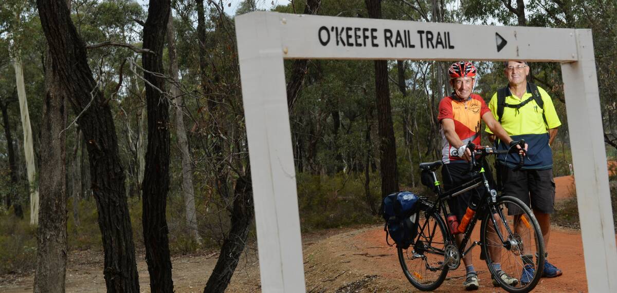 ON TRACK: Friends of the Bendigo-Kilmore Rail Trail president Garry Long and Lindsay Clay on the trail near Junortoun. Picture: DARREN HOWE