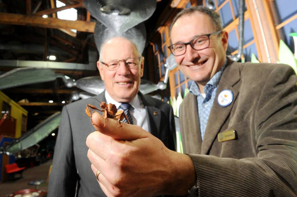 CREEPY CRAWLIES: Discovery Centre treasurer David Andrew and manager Jonathan Ridnell with a star of the new 'minibeast' exhibition. Picture: NONI HYETT 