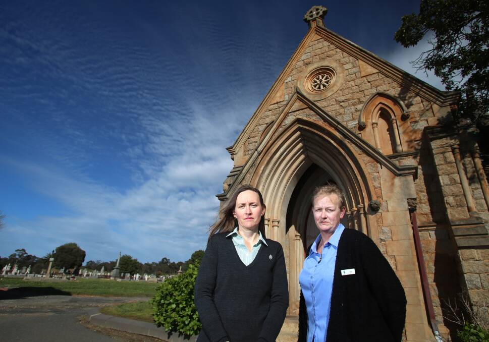 DEVASTATED: Remembrance Park's Joanne Trickey and cemetery volunteer Jodi Fuller in front of the chapel which was vandalised. Picture: GLENN DANIELS 
