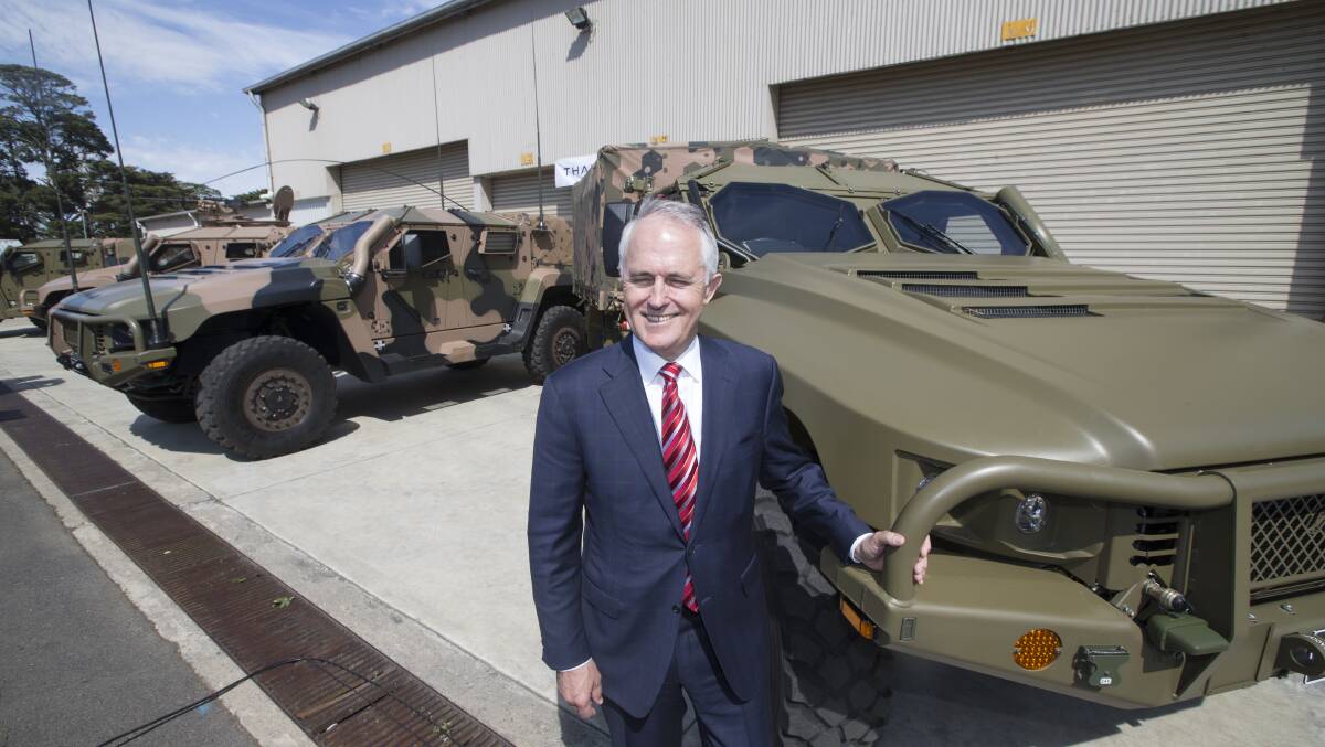 Prime Minister Malcolm Turnbull with Hawkei prototypes. 