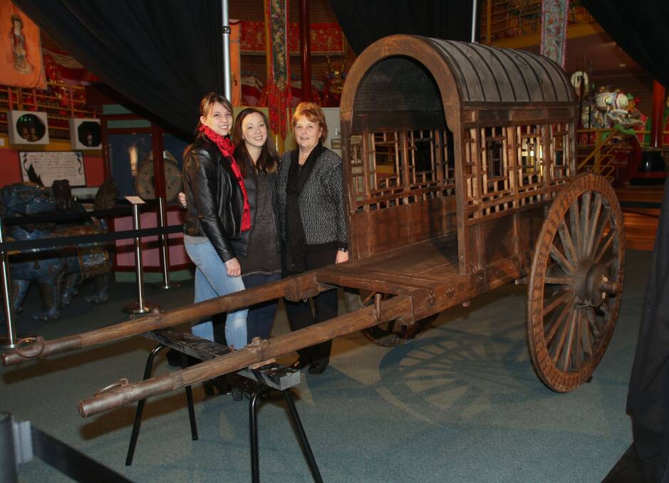 DONATION: Victoria and Stephanie Chin and Di Findlay. Picture: PETER WEAVING