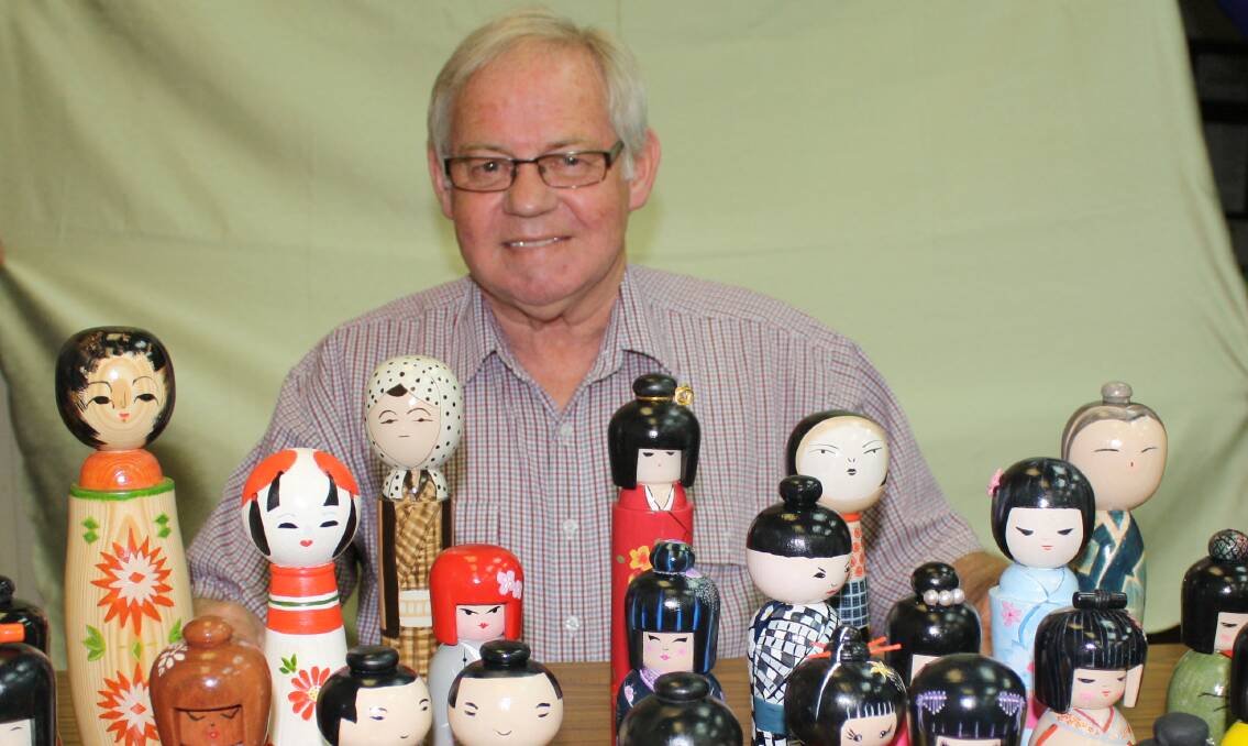 WORK OF ART: Award-winning Bendigo woodturner Robert Trigg displays his Kokeshi doll collection, which he created on a lathe.