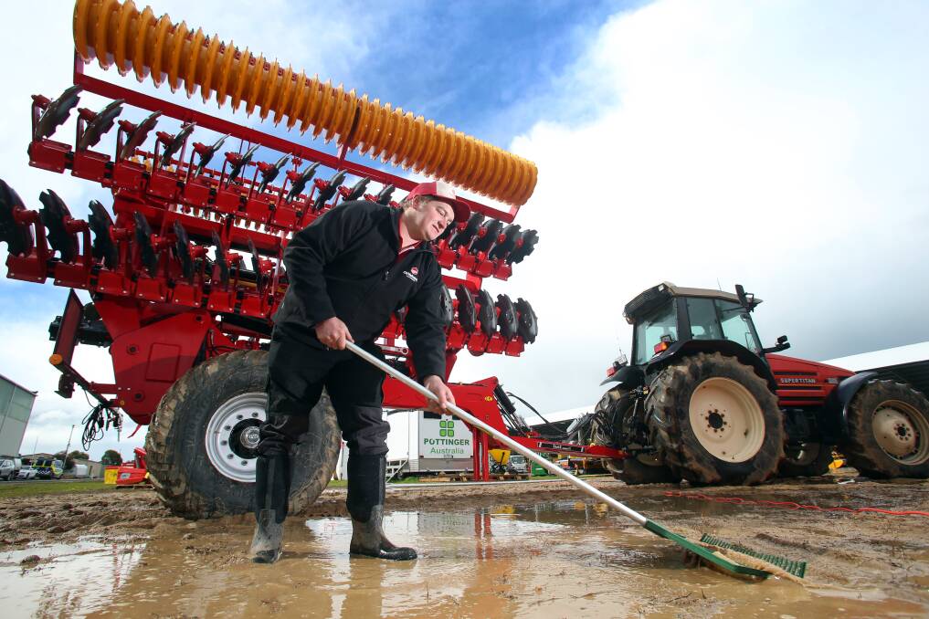 RAINY DAYS: Organisers and exhibitors work feverishly to prepare the sodden ground for the Elmore Field Days, starting on Tuesday.