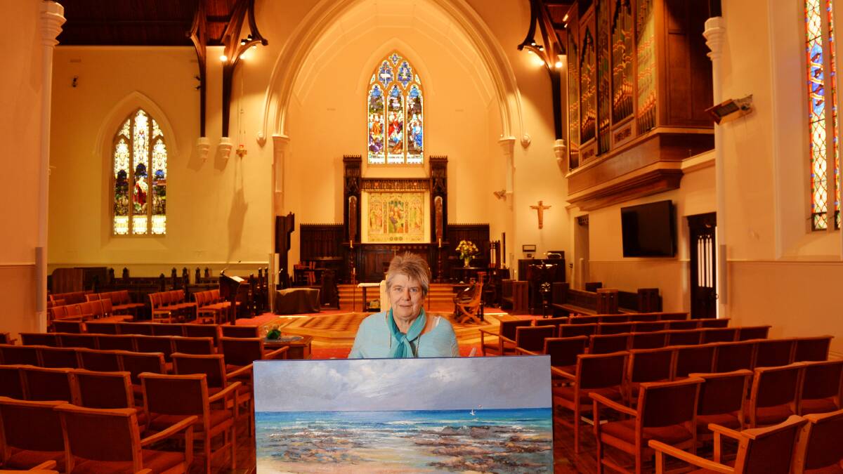 PICTURE PERFECT: Pam Fittock prepares for the opening on Friday of the 23rd annual St Paul's Art Prize, which features works from local artists. Picture: DARREN HOWE