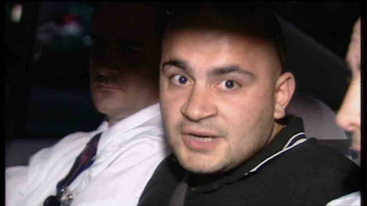 Hizir Ferman after being arrested in 2003. Picture: CHANNEL NINE