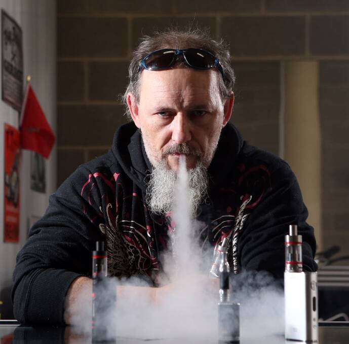 SMOKE-FREE: Former heavy smoker Karl Seymour swears his health has improved since using an e-cigarette device from Bendigo's Vape Anarchy. Picture: Glenn Daniels