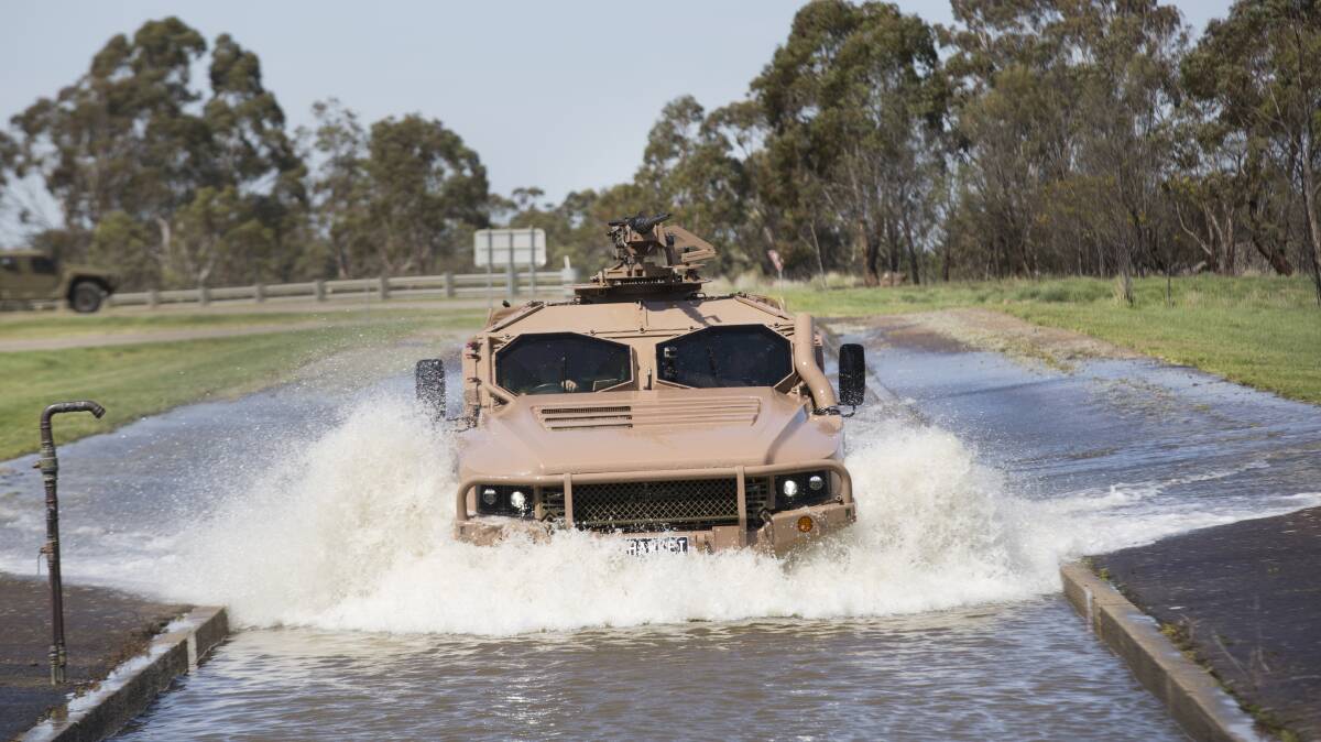 RUGGED: The Hawkei vehicle is put through it paces at the Monegeetta proving ground outside of Melbourne yesterday.