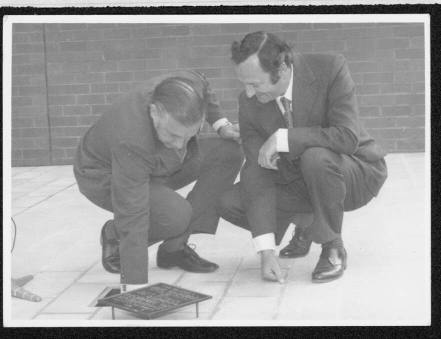 Premier Rubert Hamer with Hugh Mason planting a time capsule to celebrate the 100th anniversary of the Bendigo School of Mines on September 21, 1973.
