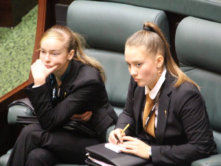 REPRESENTATIVES: Ella Hayes and Sidney Showell listen intently to debate at a session of the Youth Parliament of Victoria this week. Picture: SEAN WALES