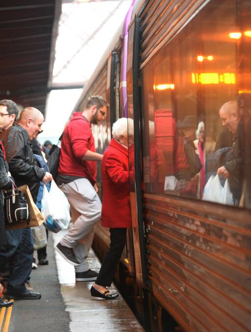 Connected: Passengers board the train at Bendigo Railway Station earlier this year. Picture: DARREN HOWE