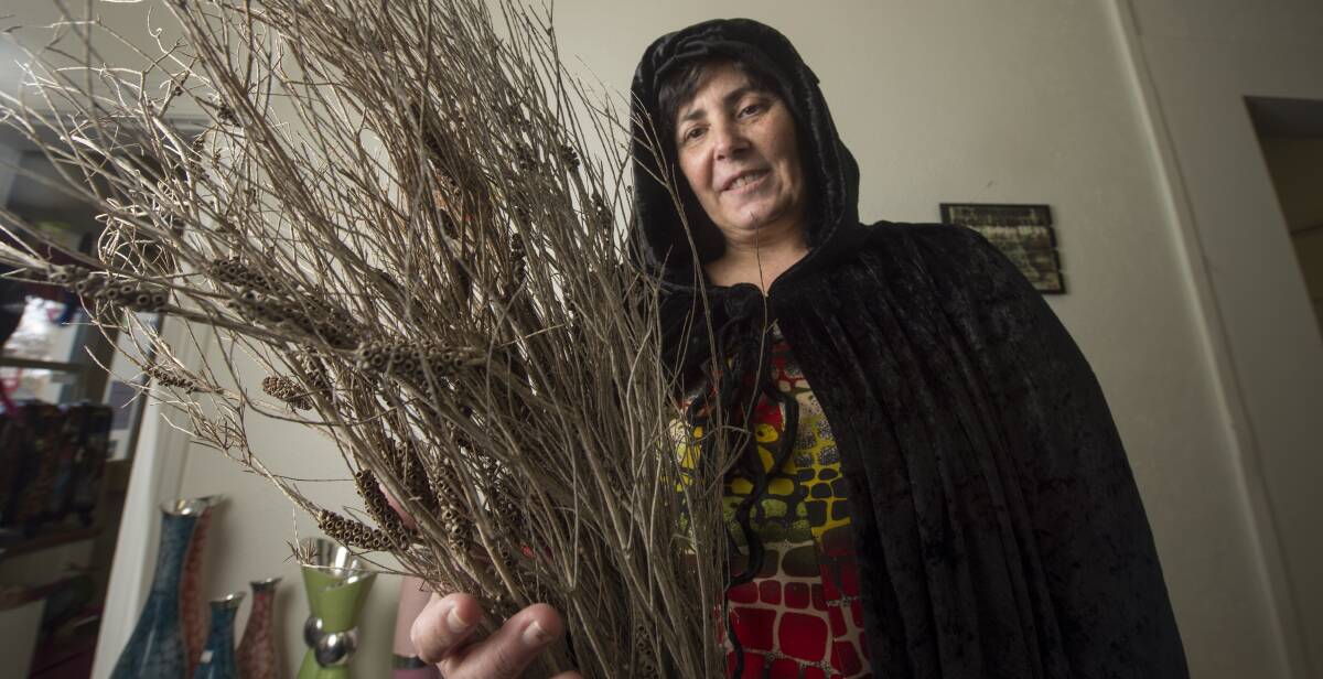 TOOLS OF THE TRADE: Johanna Hobson shows off the bristles of her new broom, which she made during witch classes a few weeks ago. Picture: DARREN HOWE