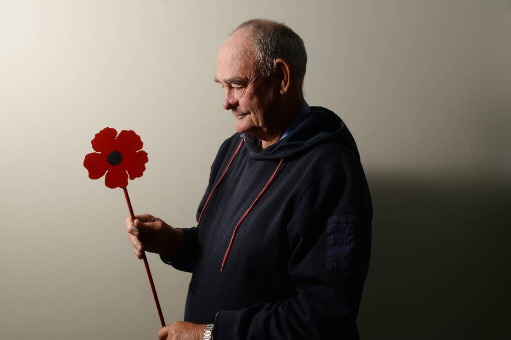 Howard Rochester with one of the metal poppies that the Inglewood Historical Society has supplied for the graves of local World War One veterans. Pictures: DARREN HOWE